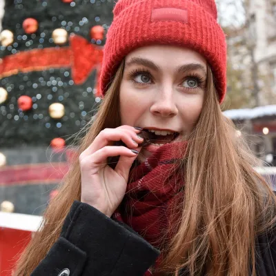 girl eating granola bonbon