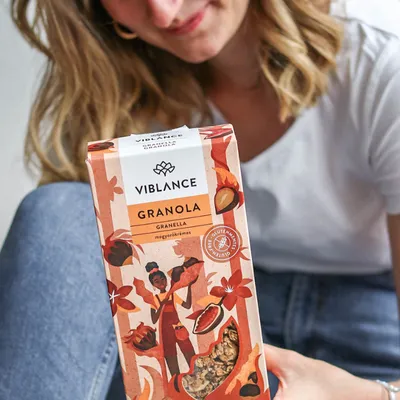 girl holding hazelnut granola